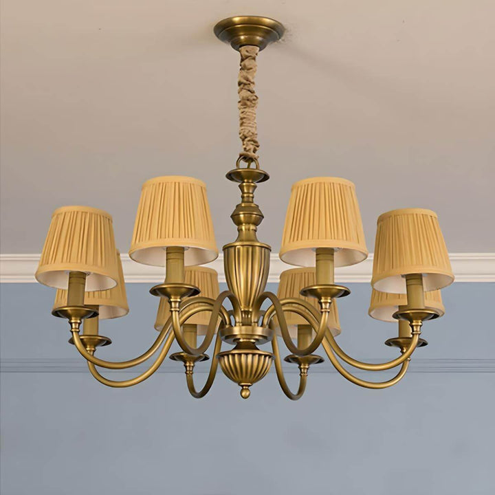 Eight-light Eryn chandelier with yellow pleated shades and a brass frame.