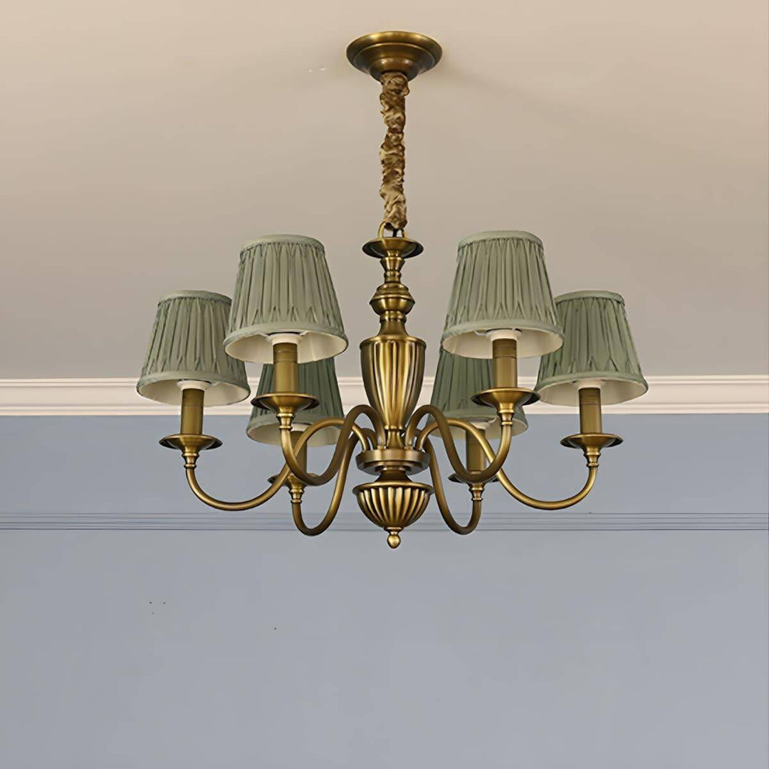 Six-light Eryn chandelier with green pleated shades and a brass frame.