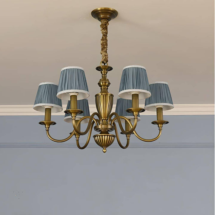 Six-light Eryn chandelier with lake blue shades and a brass frame.