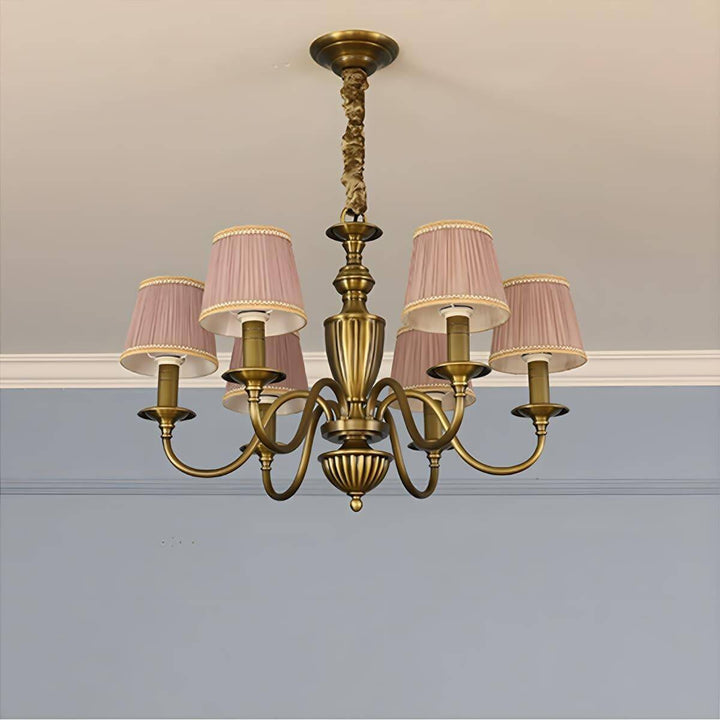 Six-light Eryn chandelier with purple pleated shades and a brass frame.