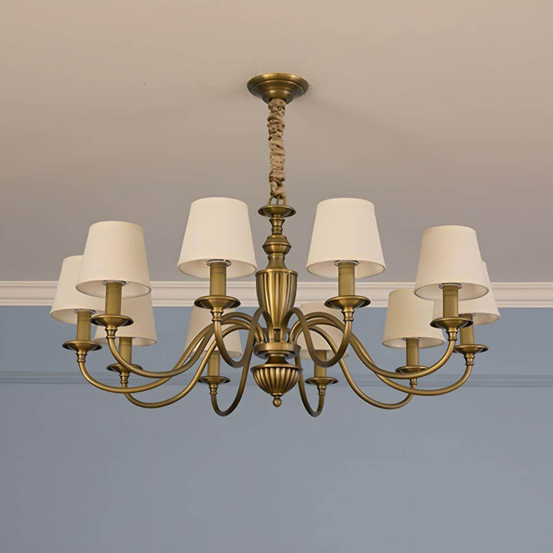 Ten-light Eryn chandelier with warm white shades and brass arms.