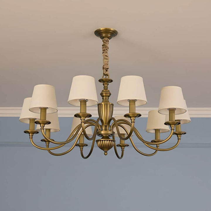 Ten-light Eryn chandelier with warm white shades and brass arms.