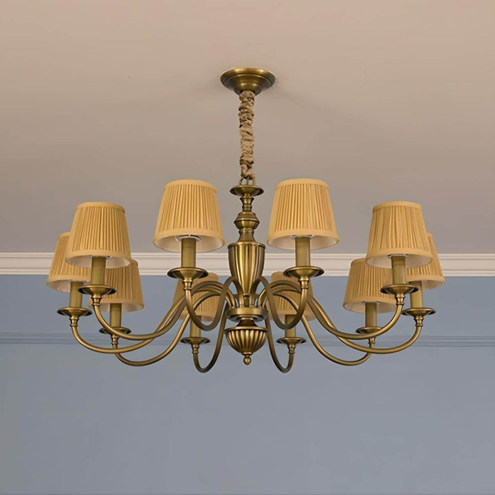Ten-light Eryn chandelier with yellow pleated shades and a brass frame.
