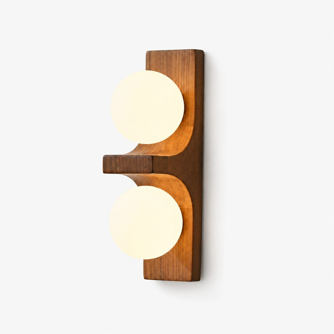 Eveline double wall sconce in dark wood with two glowing white glass globes on a white background.
