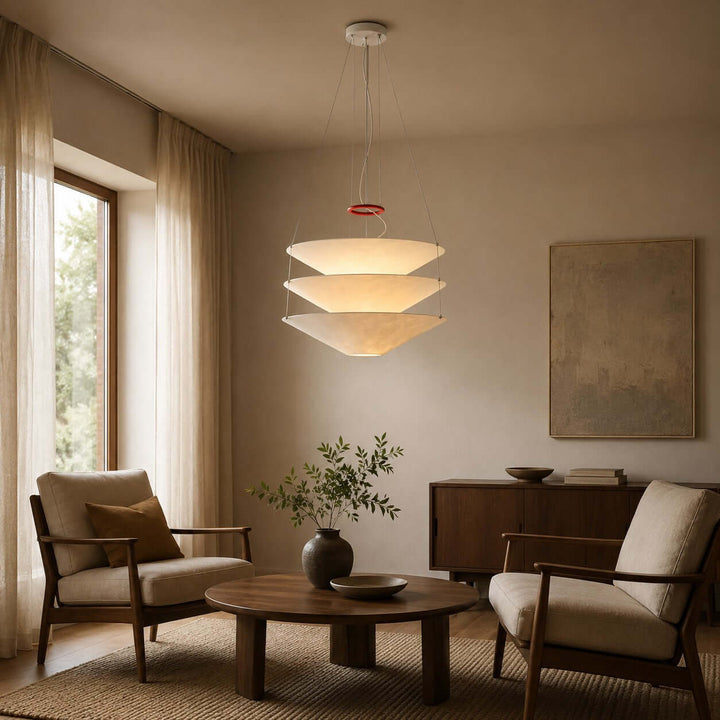 Floating pendant light above a lounge seating area with a low table.