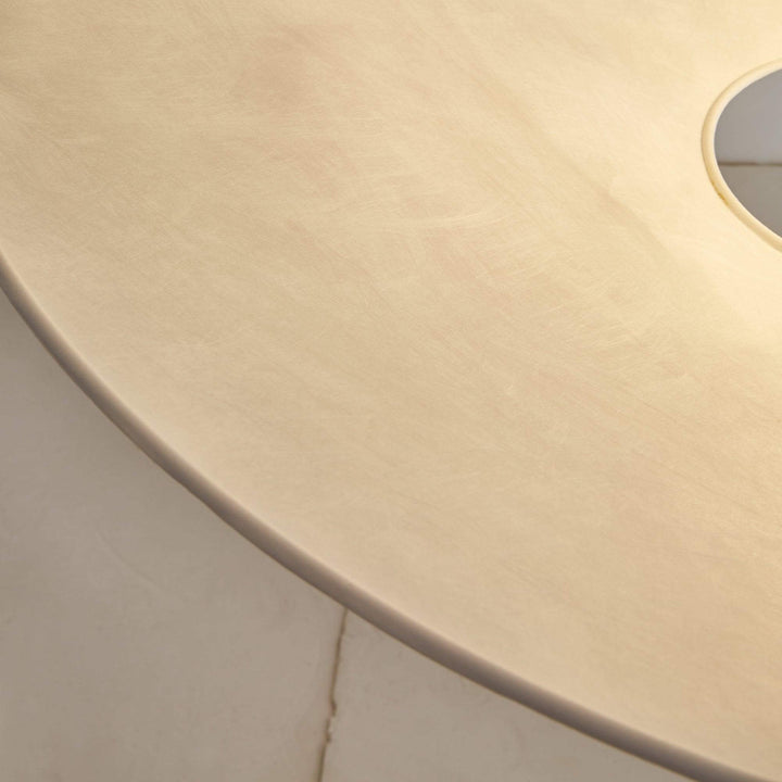 Close-up of the textured white shade surface on the pendant light.