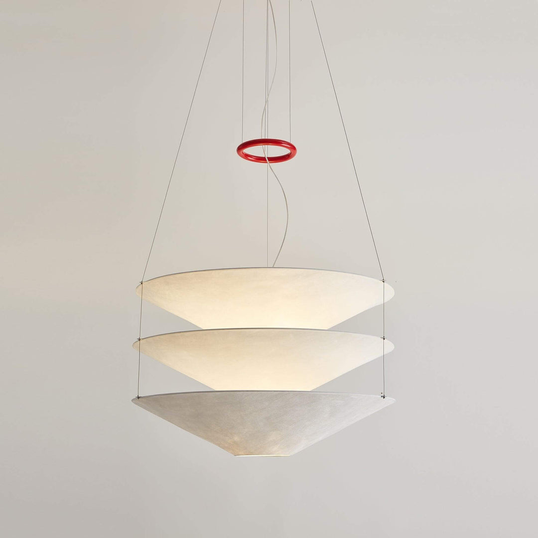 Tall studio view of the white layered floating pendant light and suspension wires.