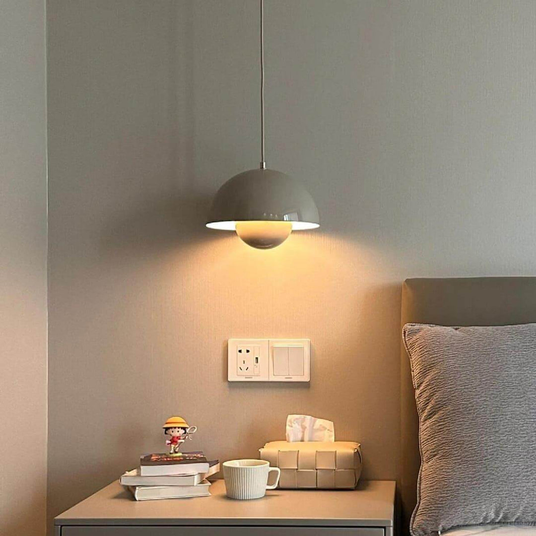 Beige gray Flowerpot pendant lamp shown above a bedside table.