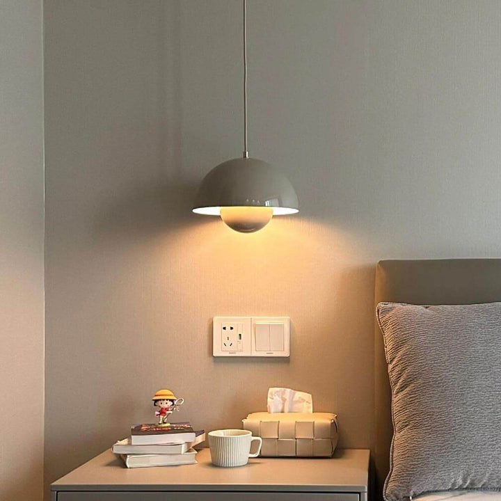 Beige gray Flowerpot pendant lamp shown above a bedside table.