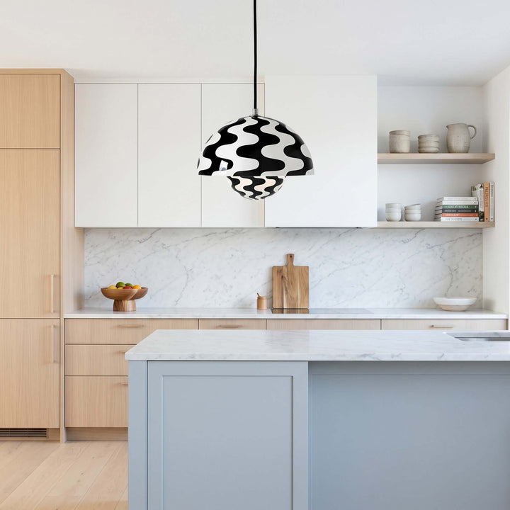 Black and white Flowerpot pendant lamp shown over a kitchen island.
