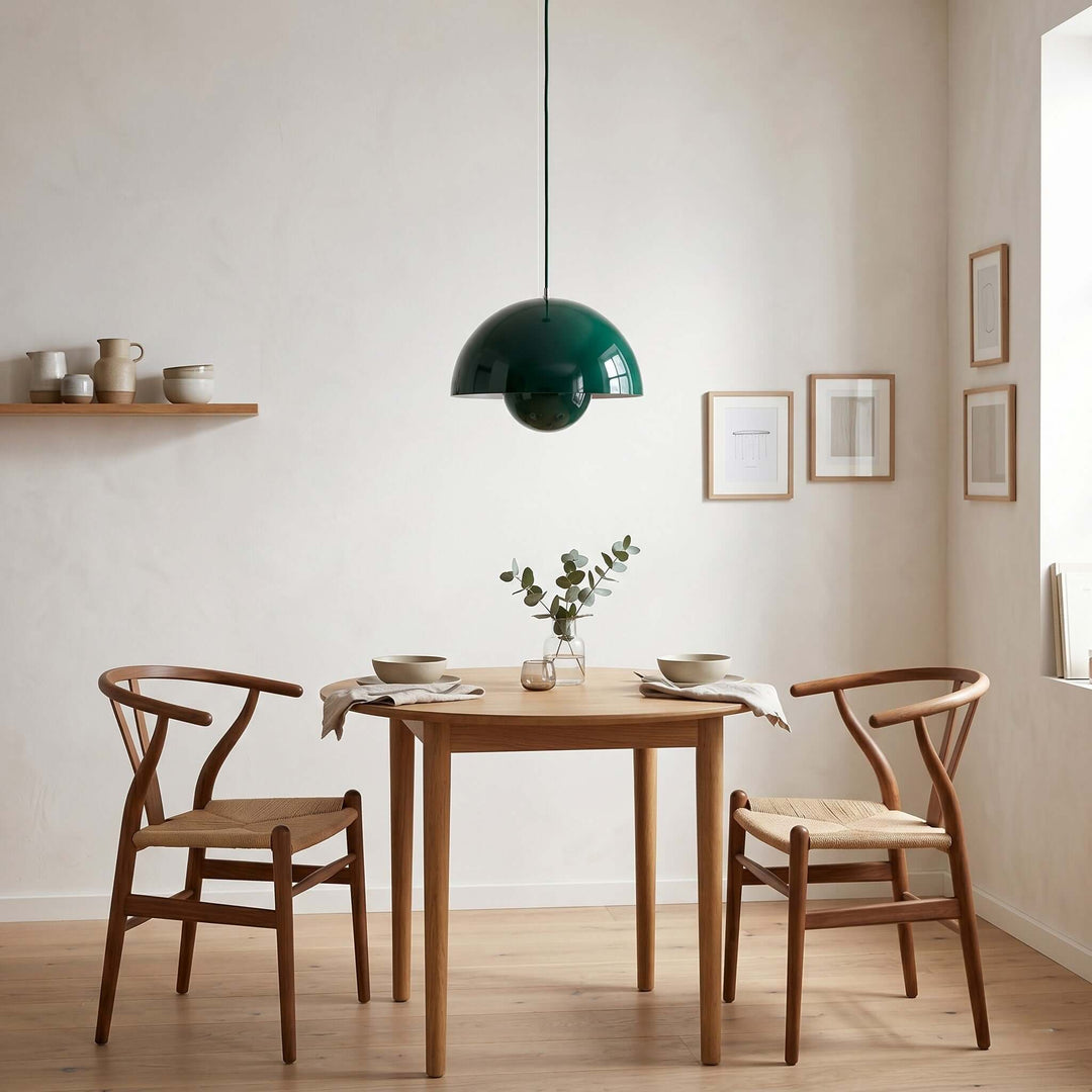 Dark green Flowerpot pendant lamp shown above a dining table.
