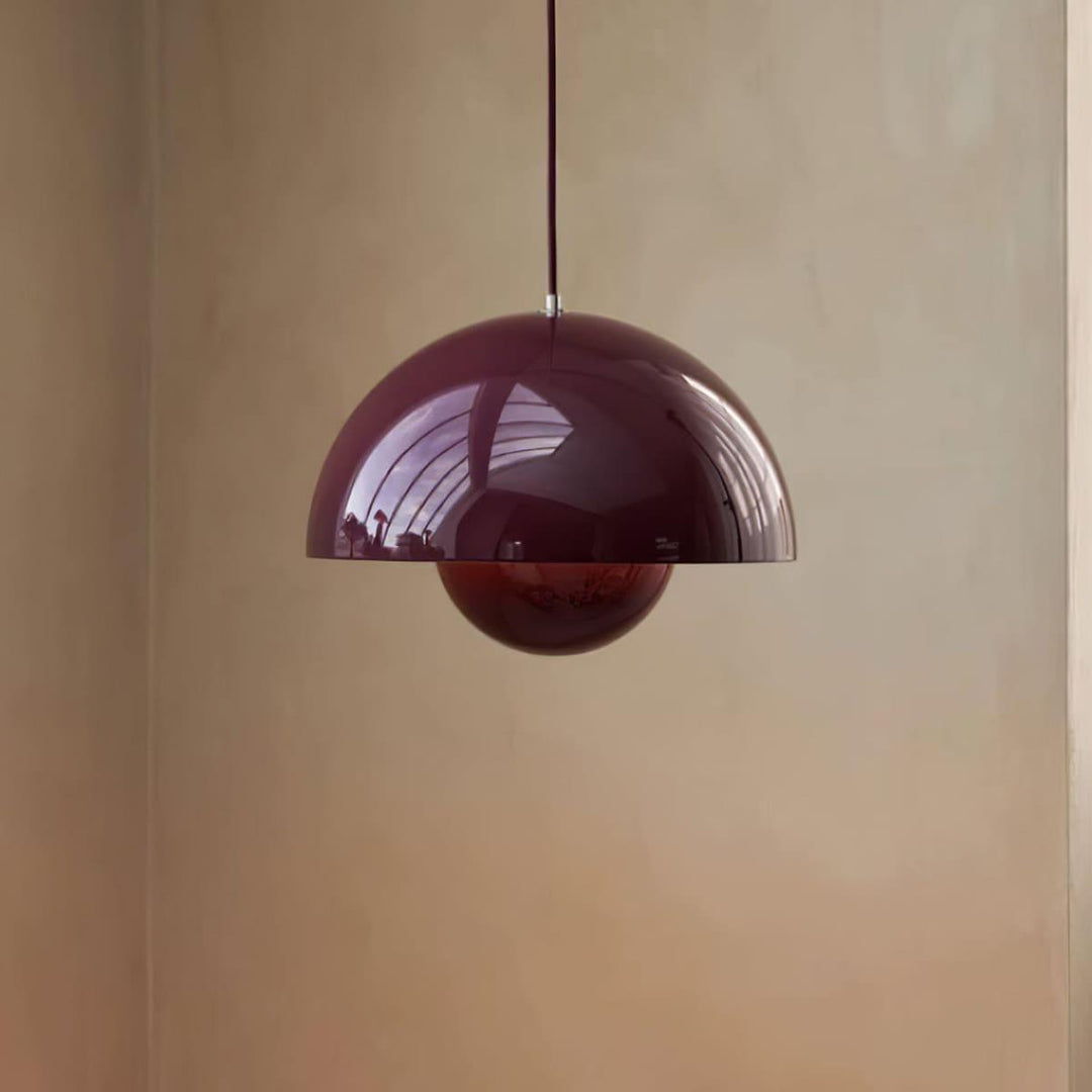 Ebony Flowerpot pendant lamp shown against a wall.