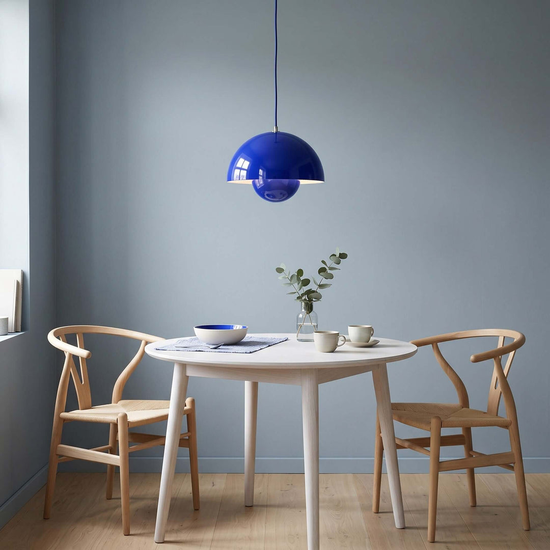 Klein blue Flowerpot pendant lamp shown above a dining table.