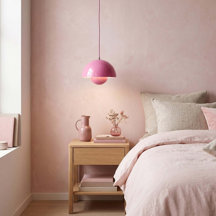 Lotus pink Flowerpot pendant lamp shown in a bedroom corner.