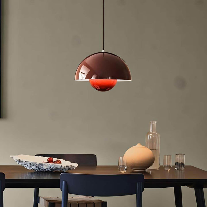 Red-brown Flowerpot pendant lamp shown above a console table.