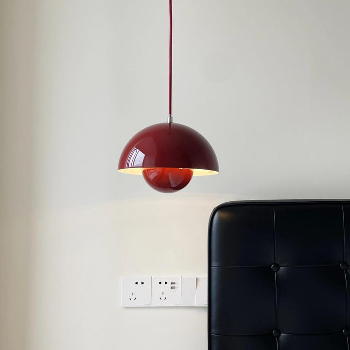 Red-brown Flowerpot pendant lamp shown against a wall.