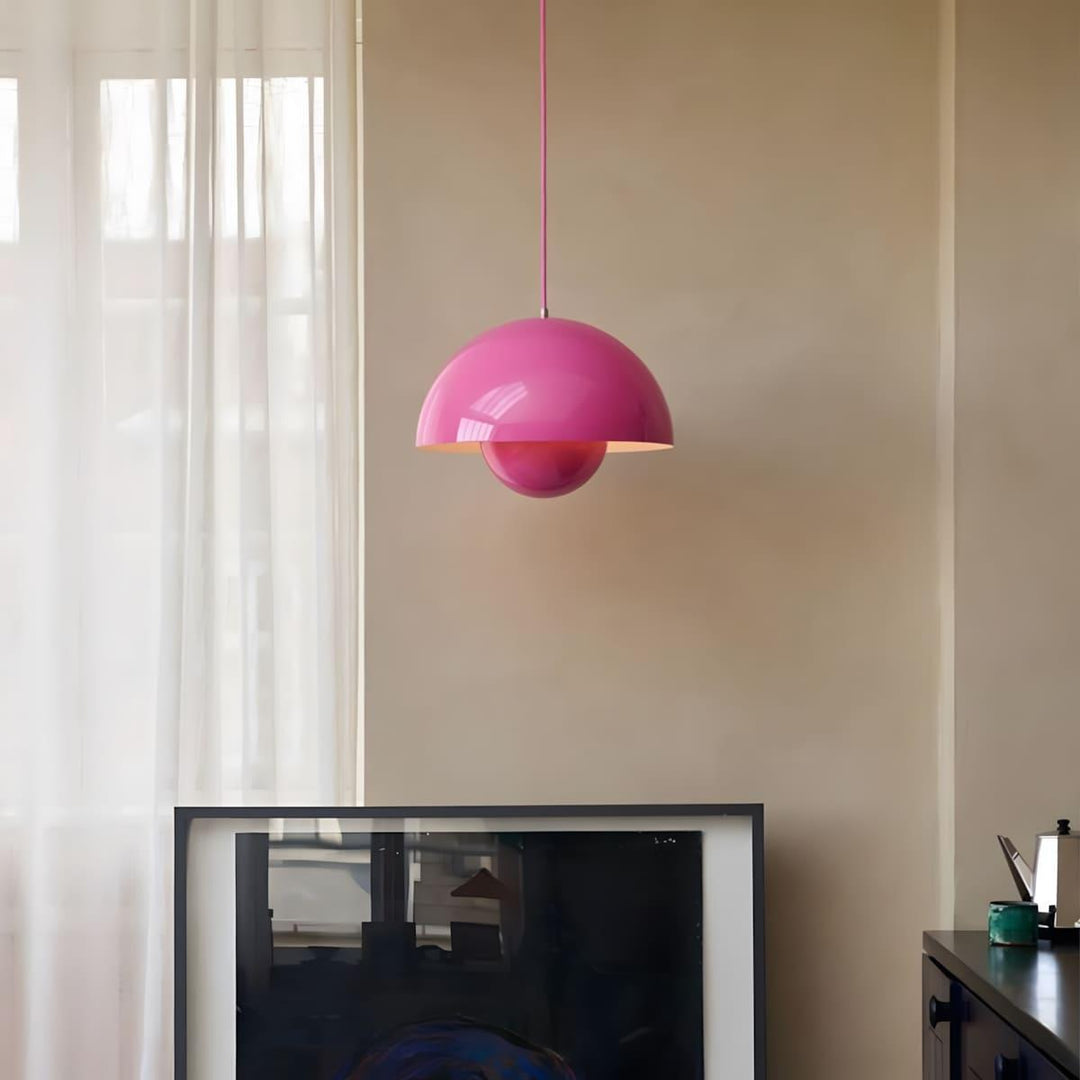 Sakura pink Flowerpot pendant lamp shown in a living room corner.