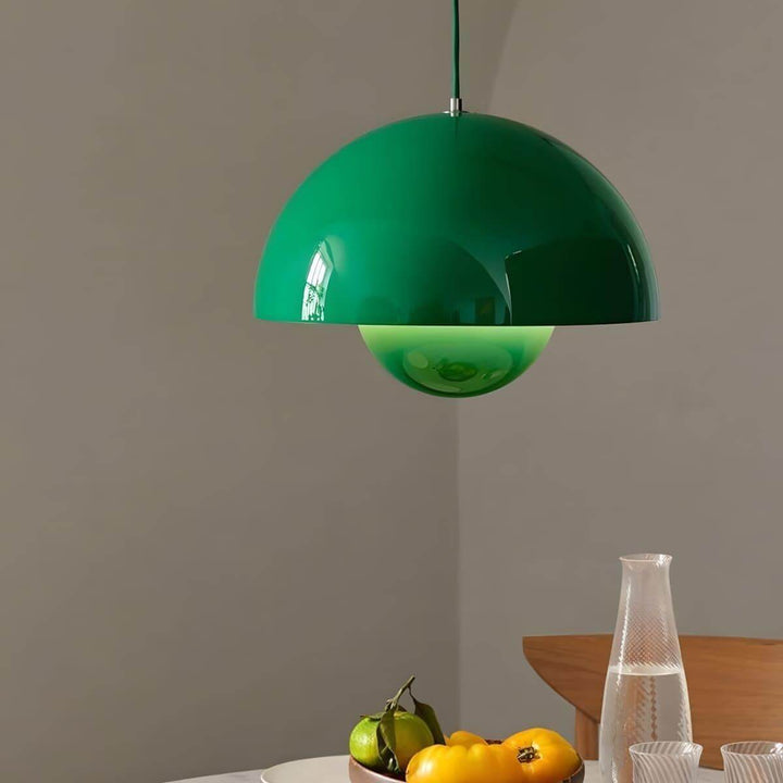 Signal green Flowerpot pendant lamp shown above a dining table.