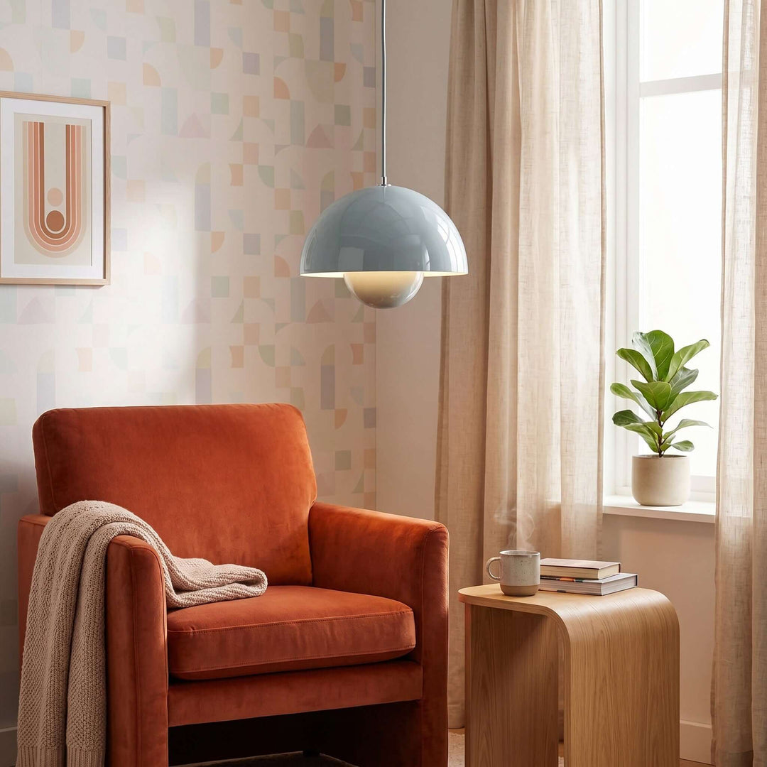 Sky blue Flowerpot pendant lamp shown in a living room seating area.