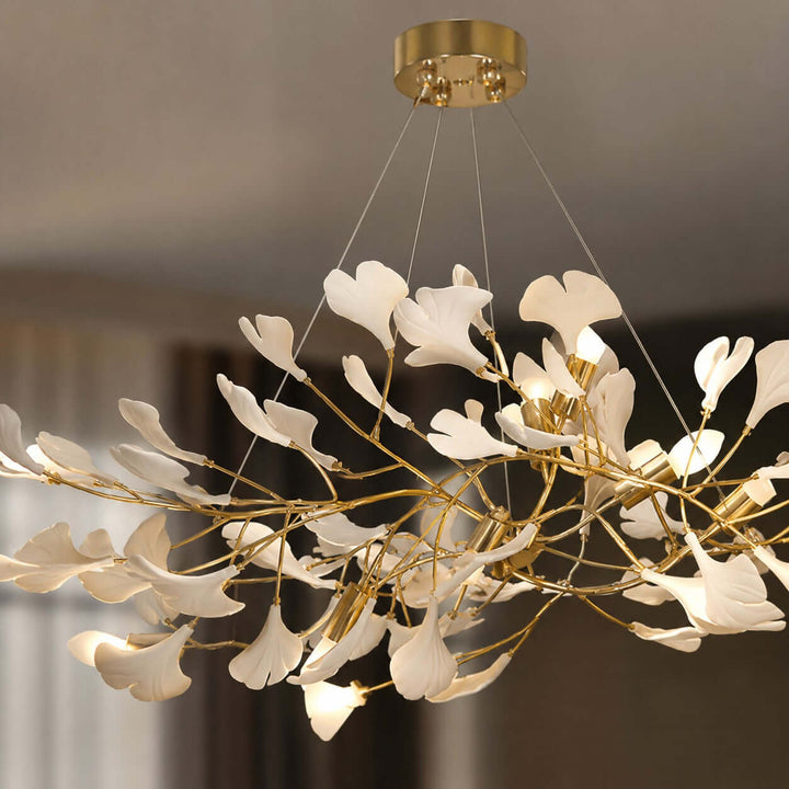 Close-up of the rose gold ceiling canopy and suspended wires on the Gingko chandelier.