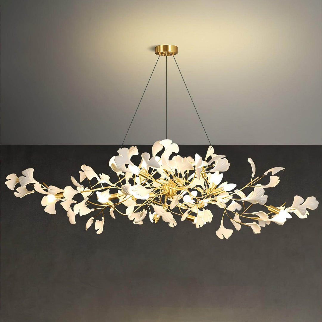 Front view of the Gingko chandelier showing layered ceramic leaves and rose gold branches.