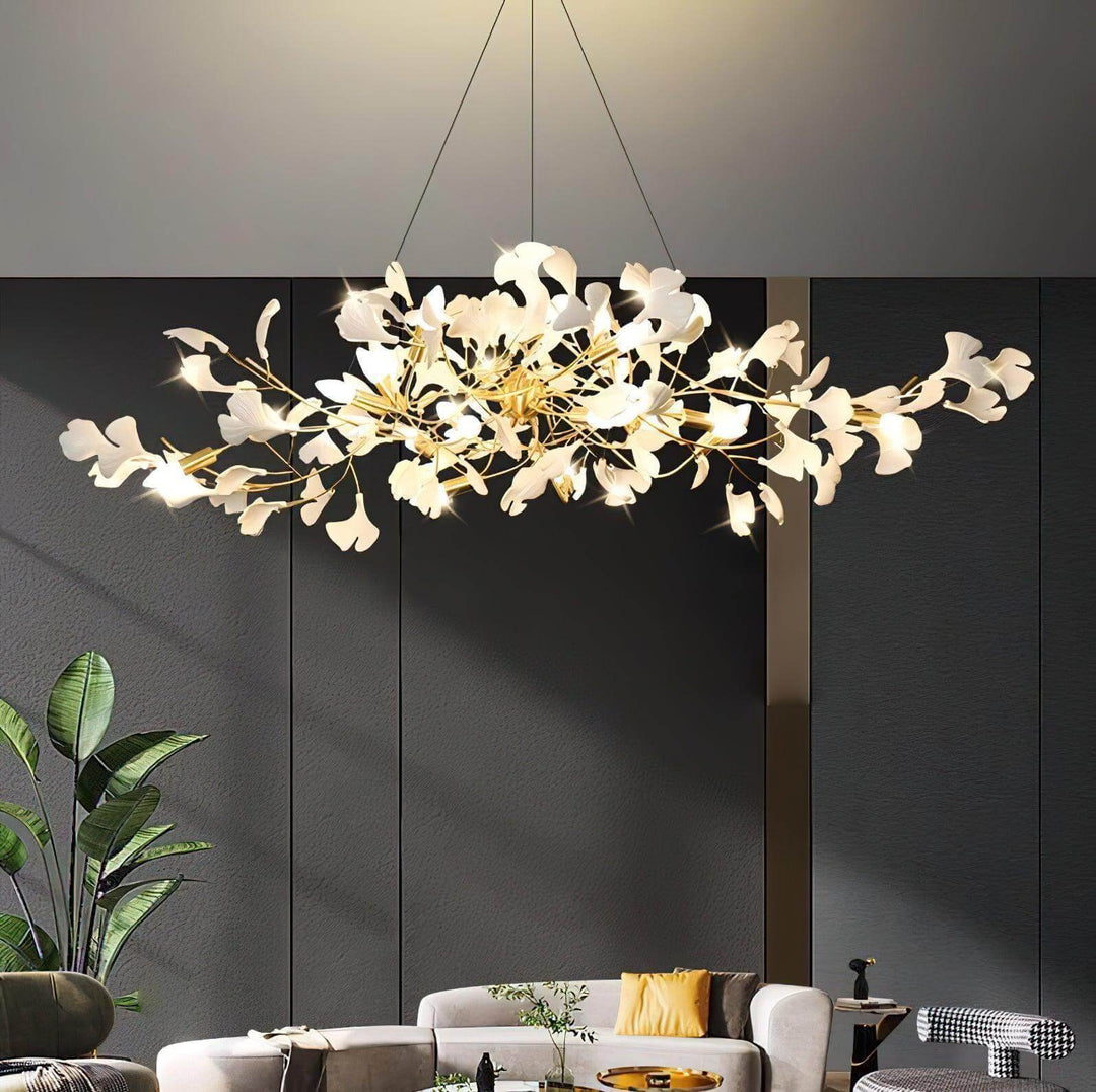 Wide ceramic leaf chandelier above a modern living room with dark wall panels.