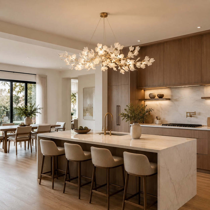 Gingko chandelier over a kitchen island in an open kitchen and dining area.
