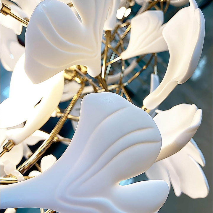 Close-up of layered white ceramic petals on the Gingko chandelier.
