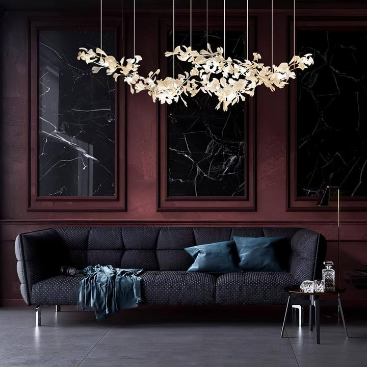 Gingko ceramic leaf chandelier displayed in a dark lounge room.