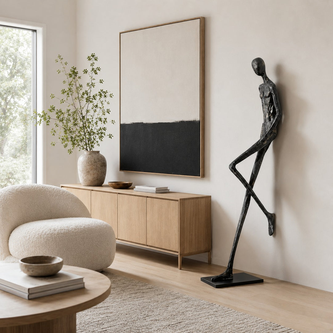 Lemvix sculpture styled beside a cabinet and abstract wall art.