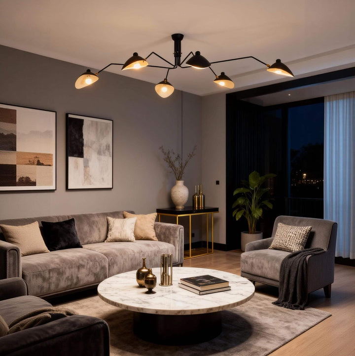 Black multi-arm ceiling light glowing above a living room seating area.