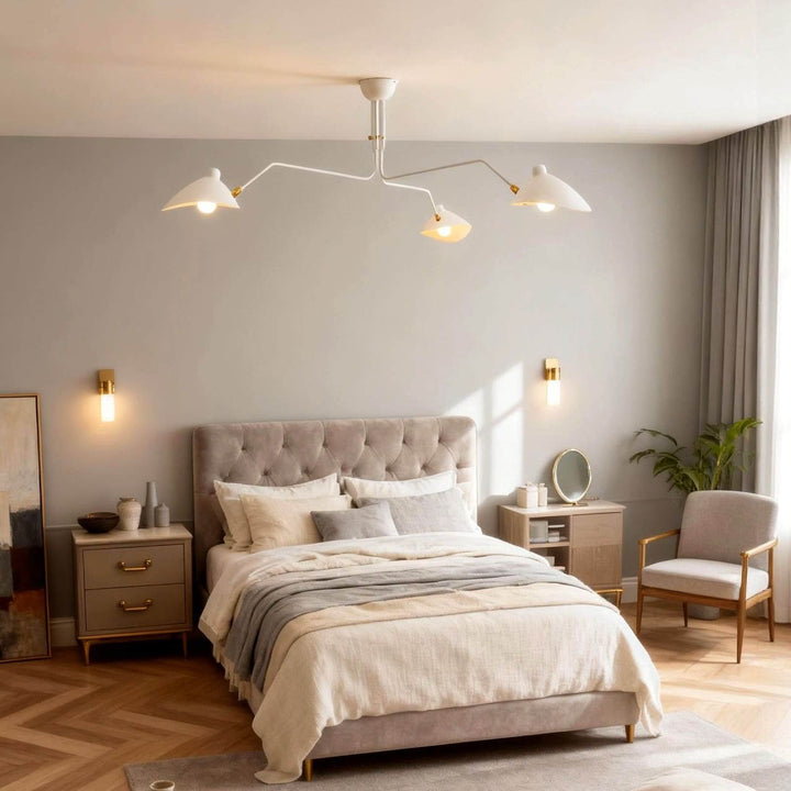 White three-light ceiling fixture installed above a bedroom.