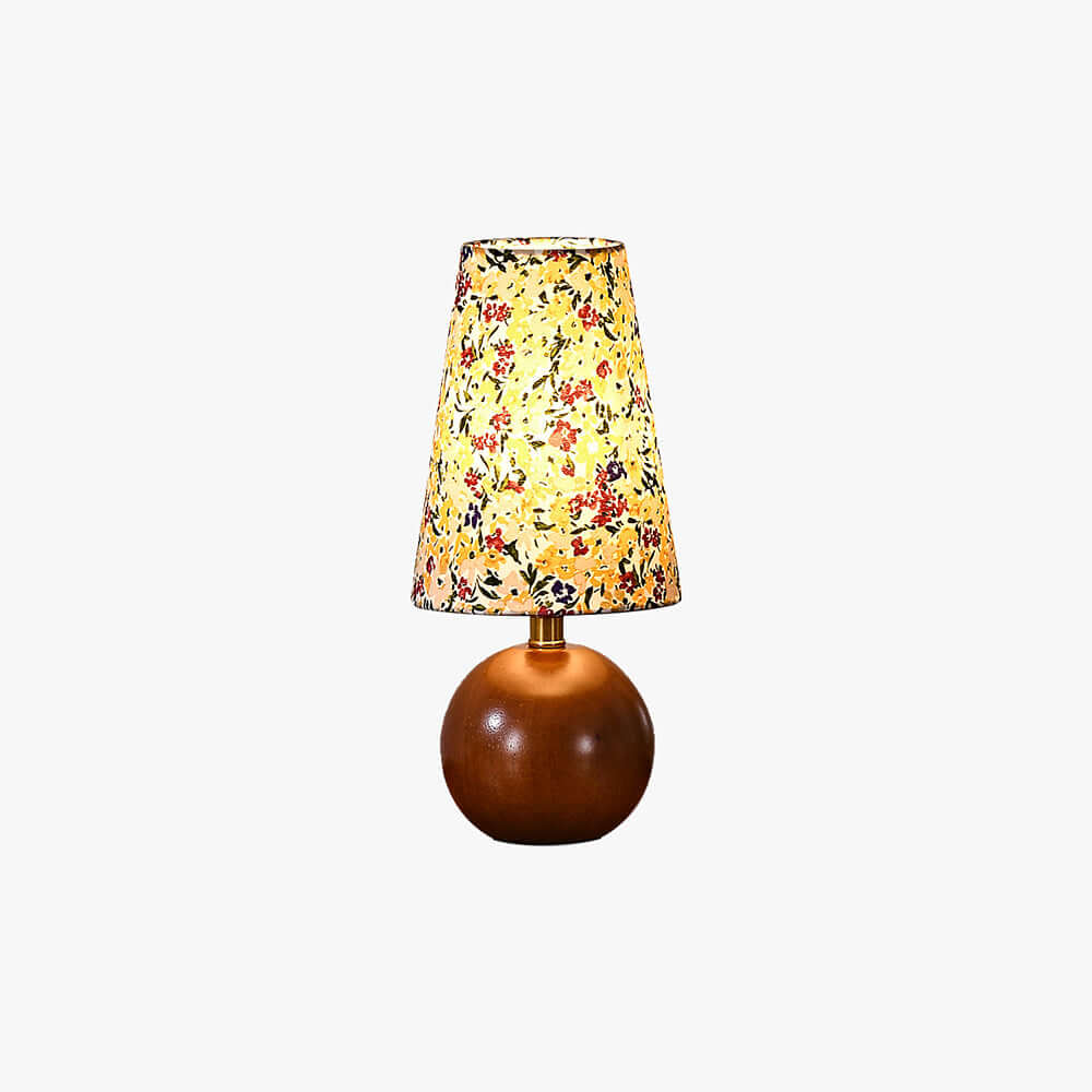 Voremi table lamp with a floral fabric shade and round wood base shown on a white background.