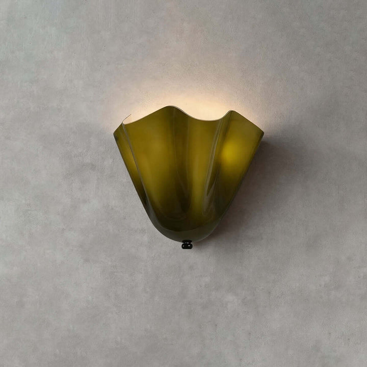 Green glass wall sconce with black hardware shown unlit on a gray wall.
