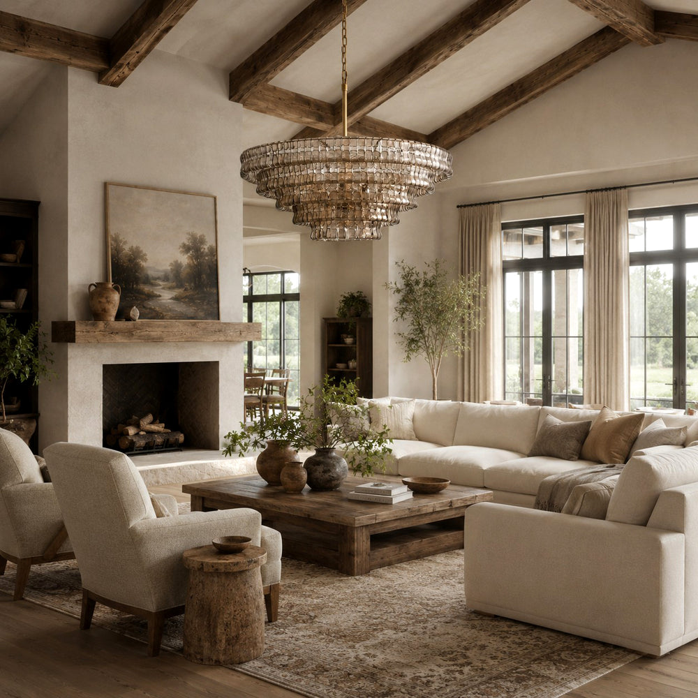 Zirvona round glass chandelier above a living room with a fireplace and sofas.