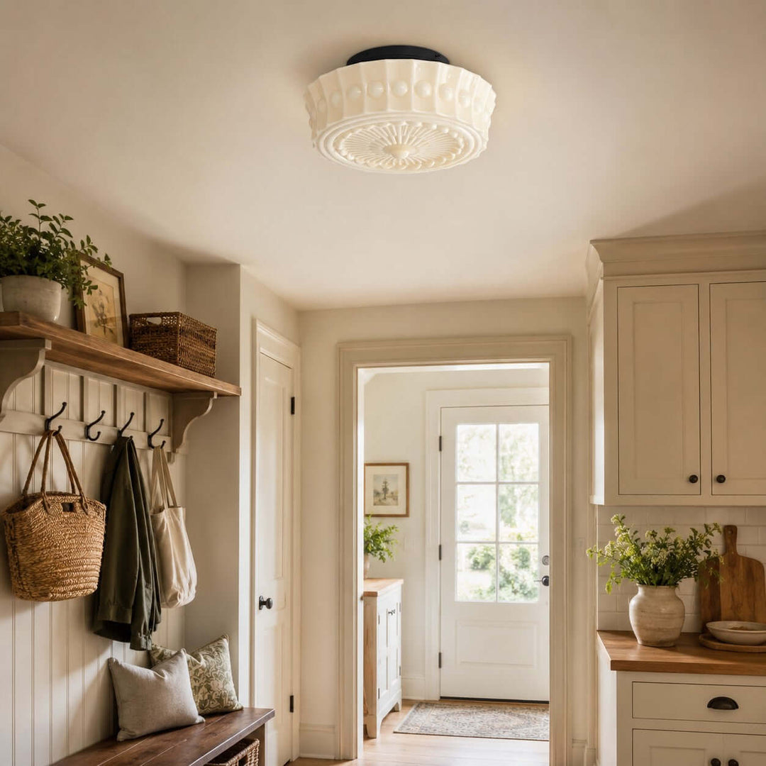 White patterned glass flush mount ceiling light in a farmhouse-style entryway and mudroom