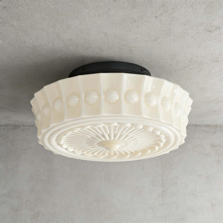 Creamy vintage round ceiling light with embossed milk glass shade and black ceiling mount