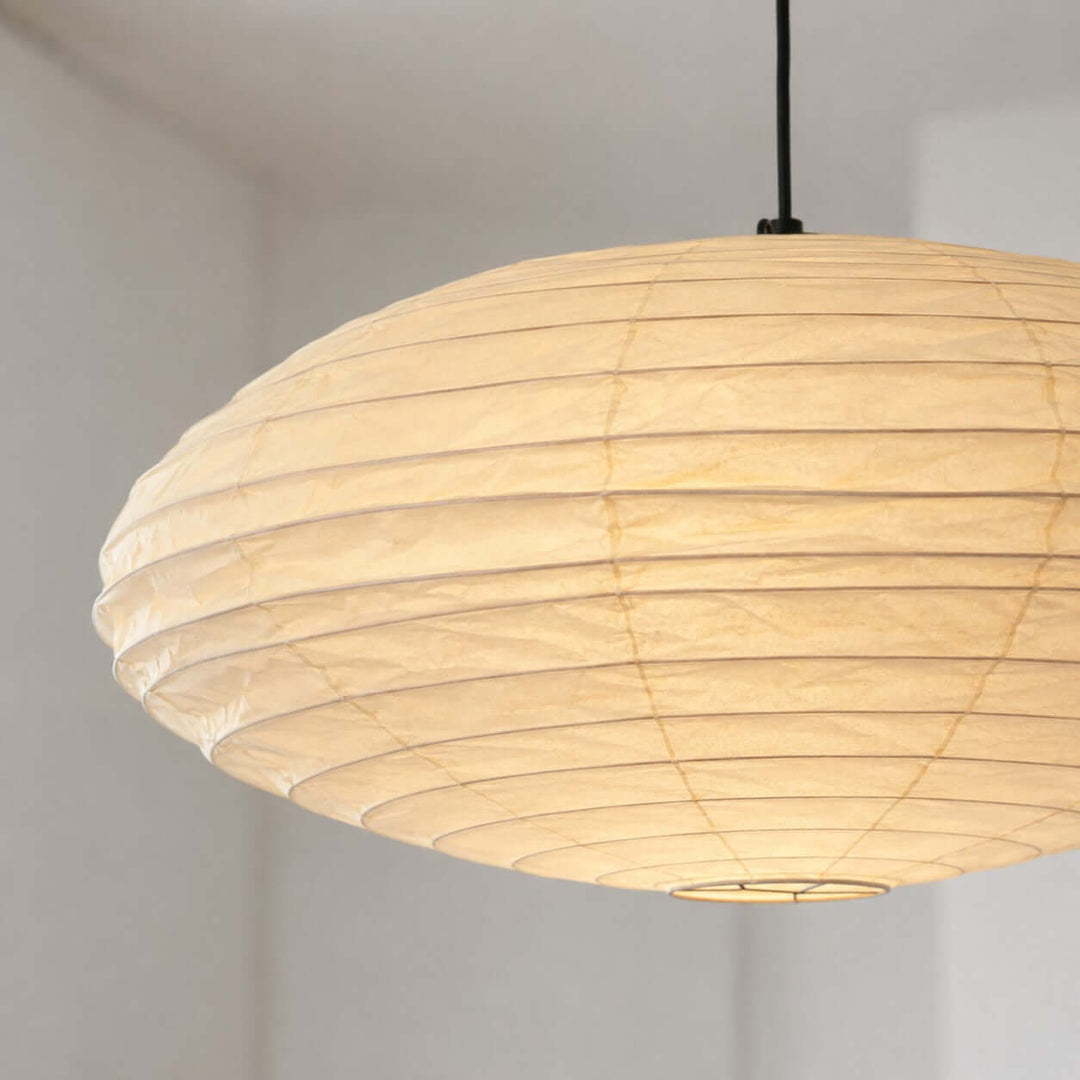 Close-up of the washi paper pendant shade and black cord.