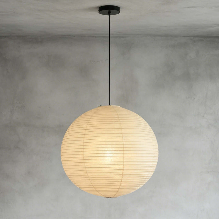 Washi paper globe pendant light with black cord and black ceiling canopy
