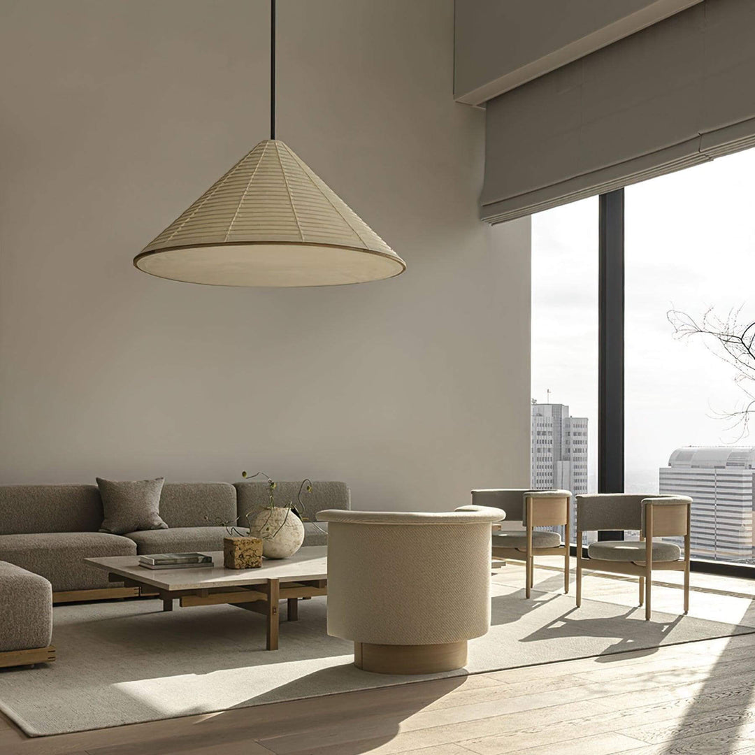 Large Washi paper pendant light in a sunlit high-rise living room with neutral modern furniture