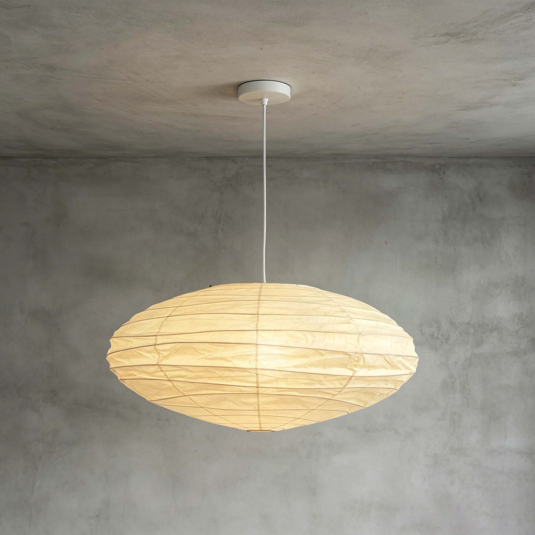 White cord washi paper pendant light against a gray wall.