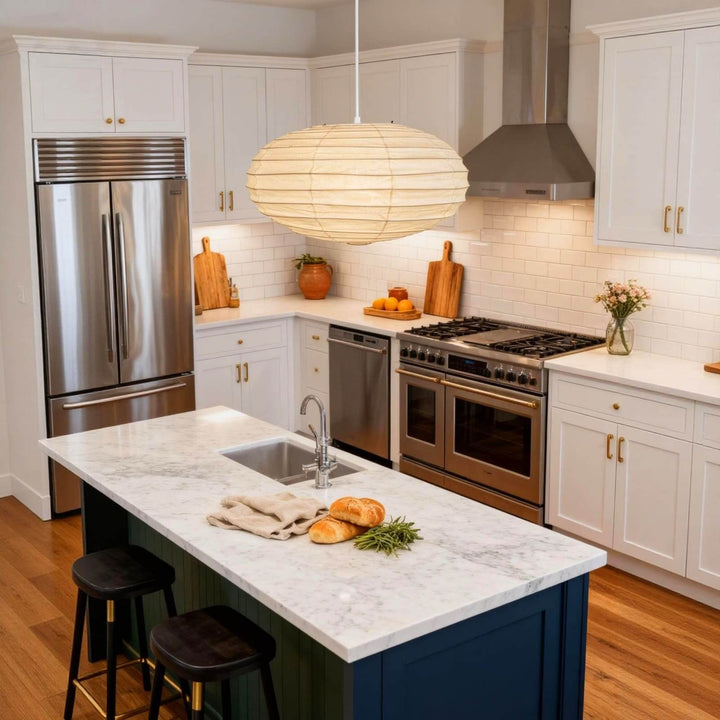 White cord washi paper pendant light over a kitchen island and range.