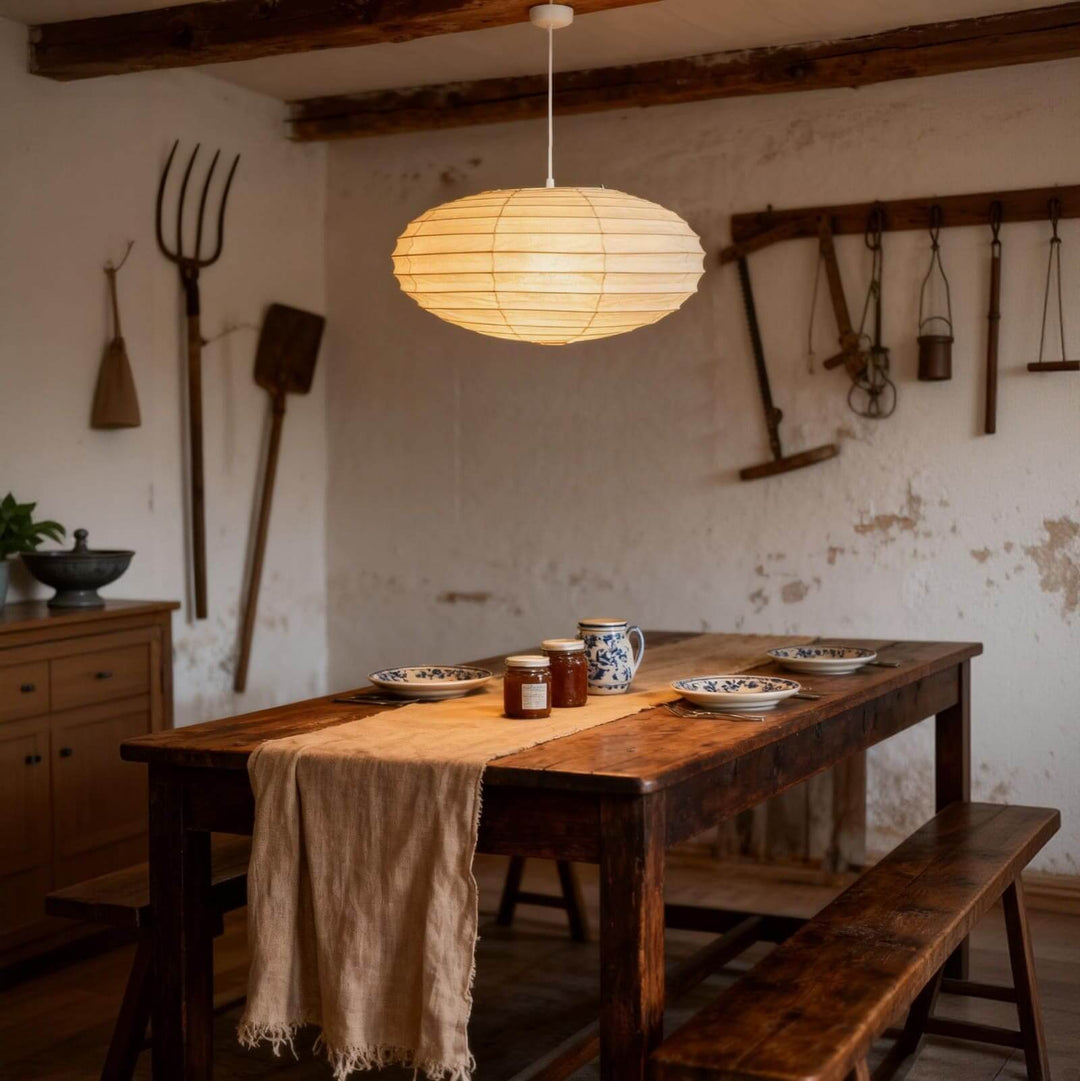 White cord washi paper pendant light above a rustic dining table.