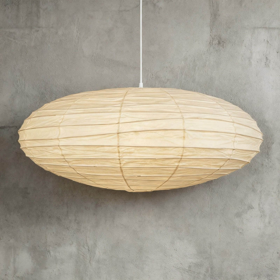 White cord washi paper pendant light shown in a wide close view.