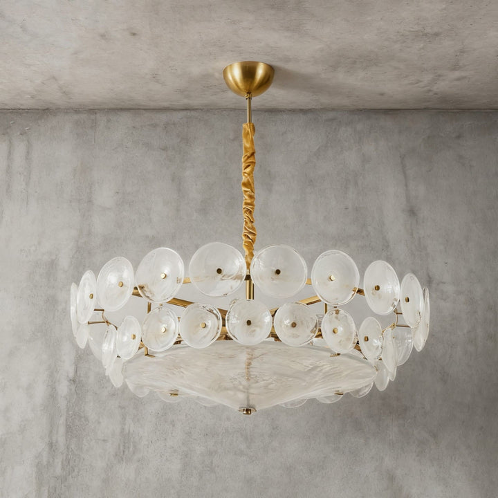 Bottom view of a white glass chandelier showing its circular discs and diffuser