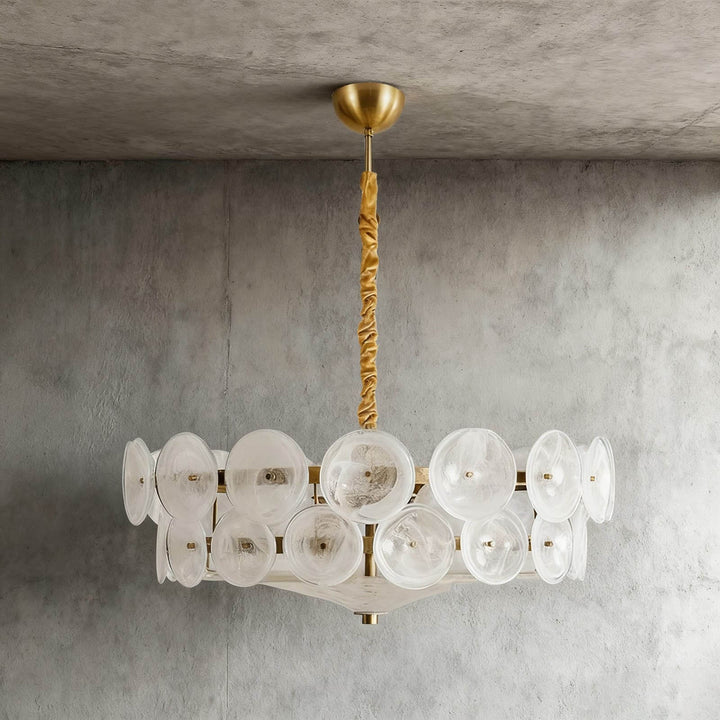 Front view of a round white glass chandelier with overlapping textured discs