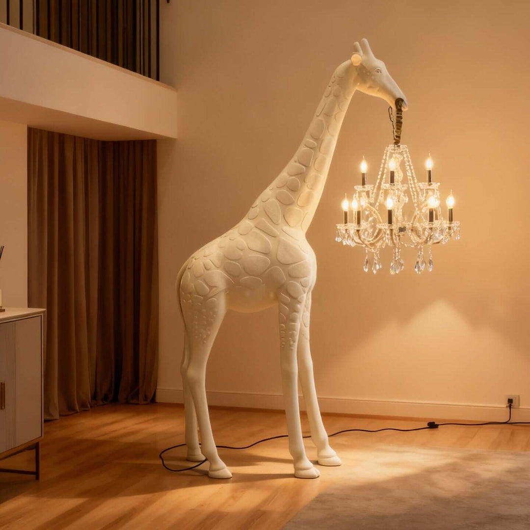 White and gold giraffe chandelier floor lamp illuminating an open living space