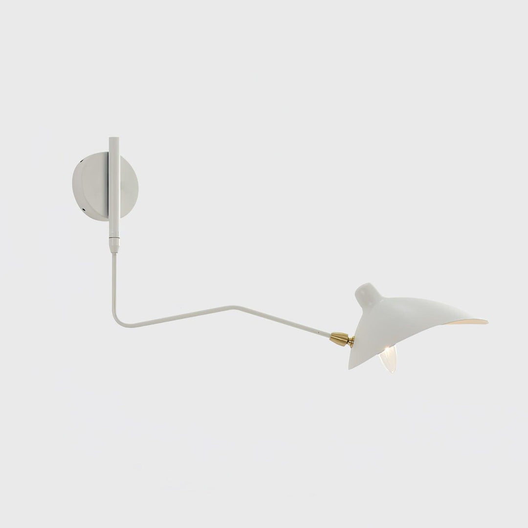 White one-light swing arm wall sconce with a brass joint on a light background