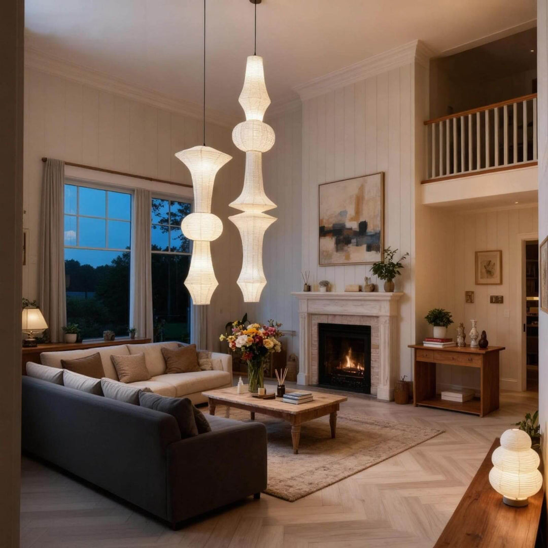 White Washi paper pendant light glowing beside a sofa and wood cabinet in a cozy living room corner