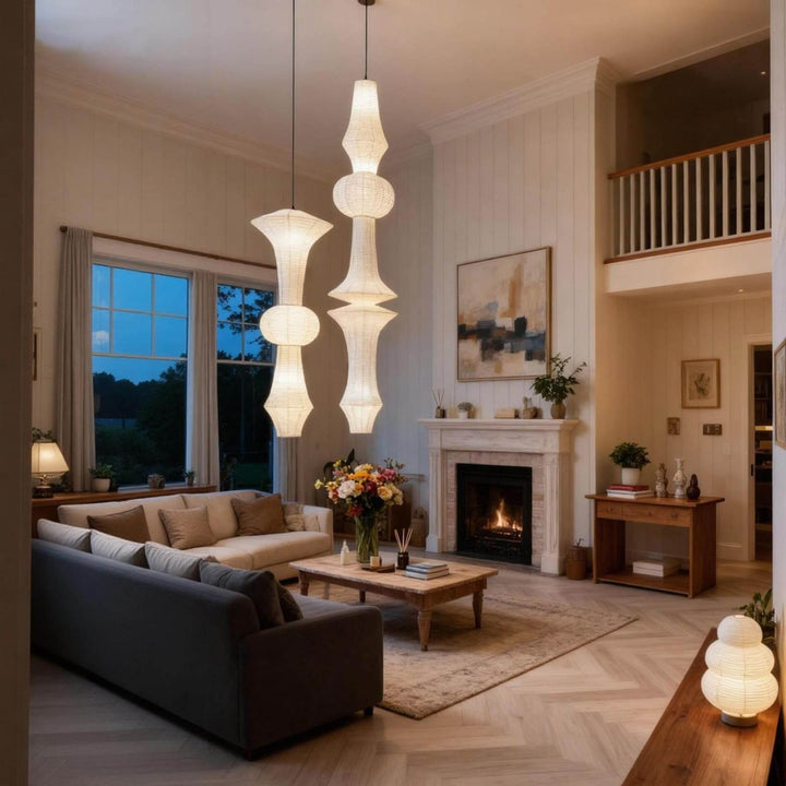White Washi paper pendant light glowing beside a sofa and wood cabinet in a cozy living room corner